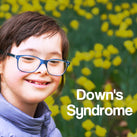 A white panel with the words – Downs Syndrome – on it