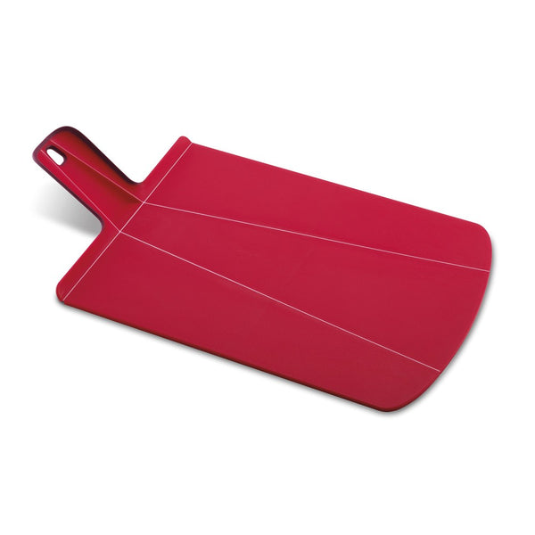 shows the josephjoseph chop 2 pot folding chopping board in large